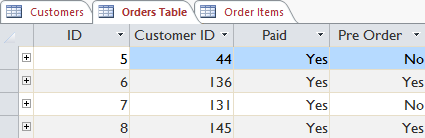 The Customer ID field links to the Customers table