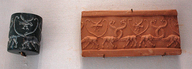 Uruk-period cylinder seal with stamped clay tablet (4100-3000 BCE)