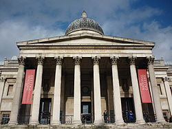 The entrance portico facing onto Trafalgar Square. The inscription was added during refurbishment work on the building in 2004–5.[41]